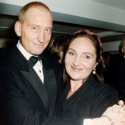 Both Joanna Haythorn and Charles Dance is wearing all black as Charles is hugging Joanna.